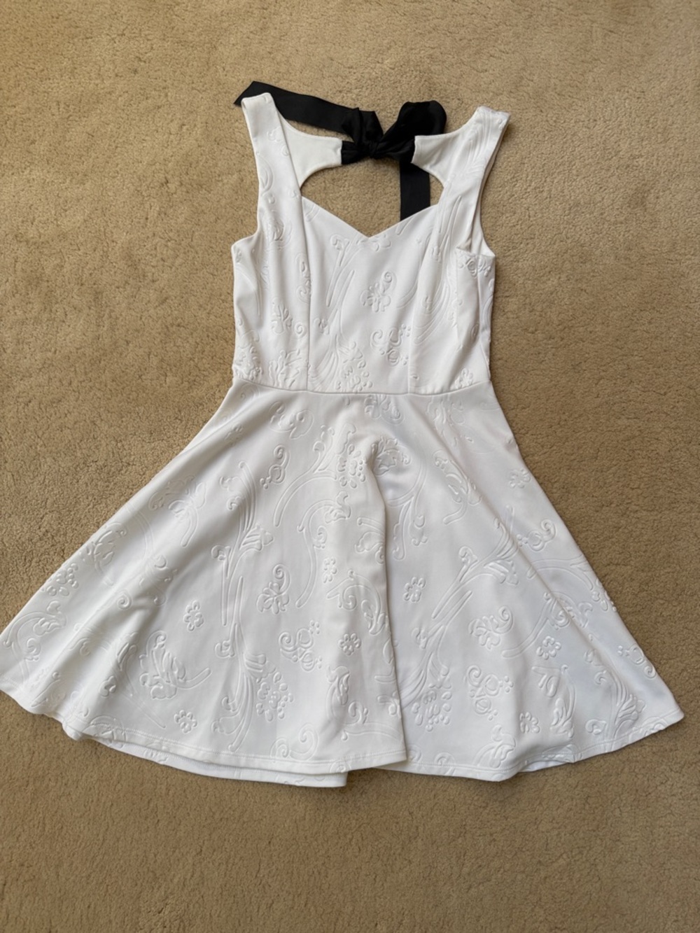 White Textured Fit-and-Flare Dress with Black Bow Back